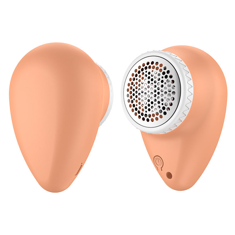 A portable lint shaver in a peach color, designed for fabric pilling worries, perfect for home use.